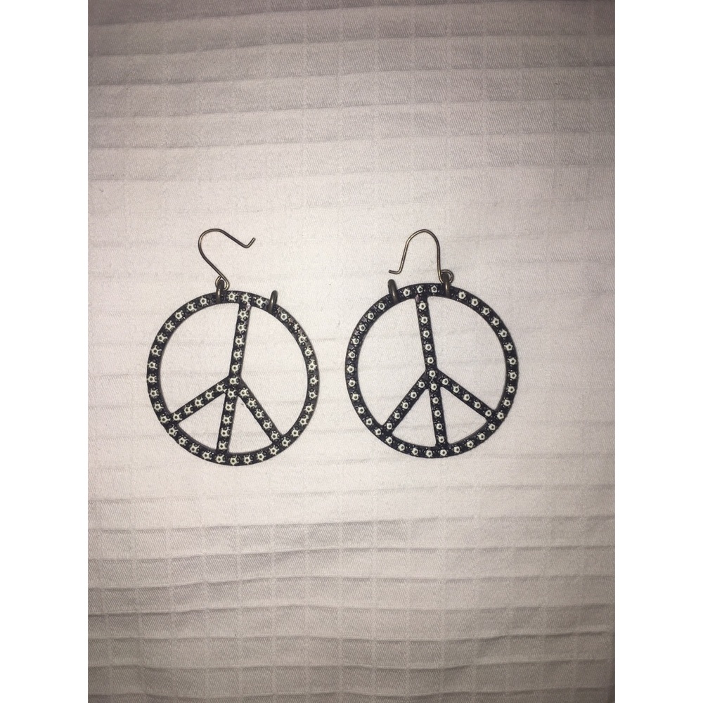 Gold peace sign earrings with design